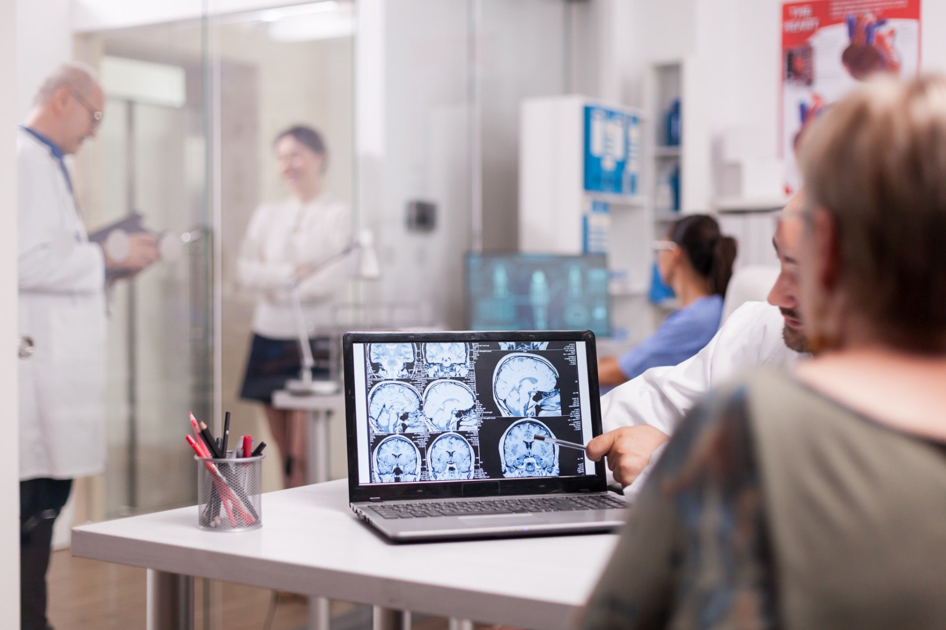 Doctor and patient reviewing a brain scan during a neurogenic MSC discussion
